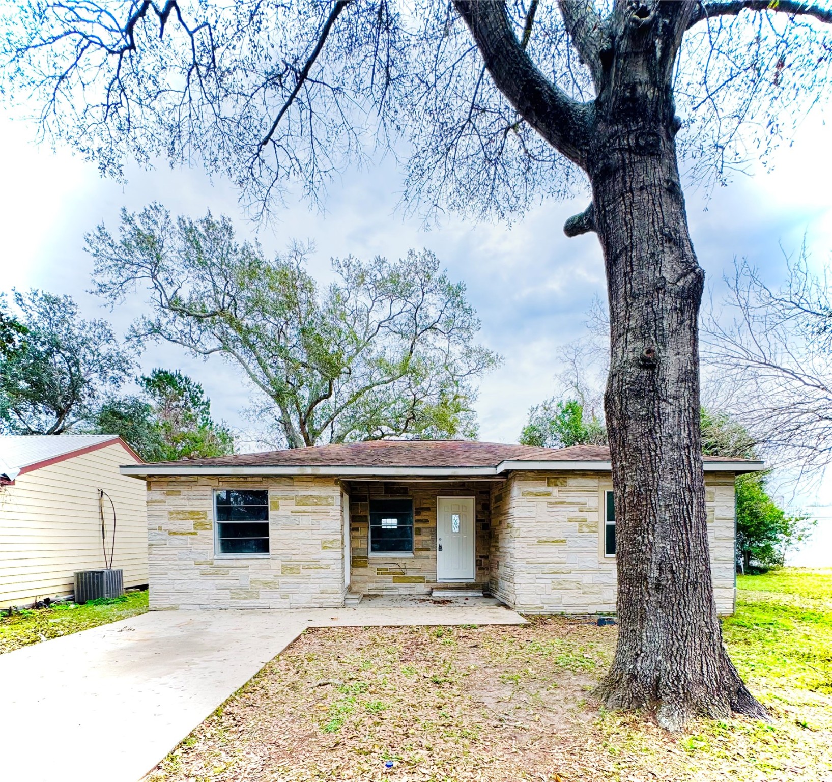1824 Reese Street Liberty, TX 77575 - Photo 1 of 14 a front view of a house with garden