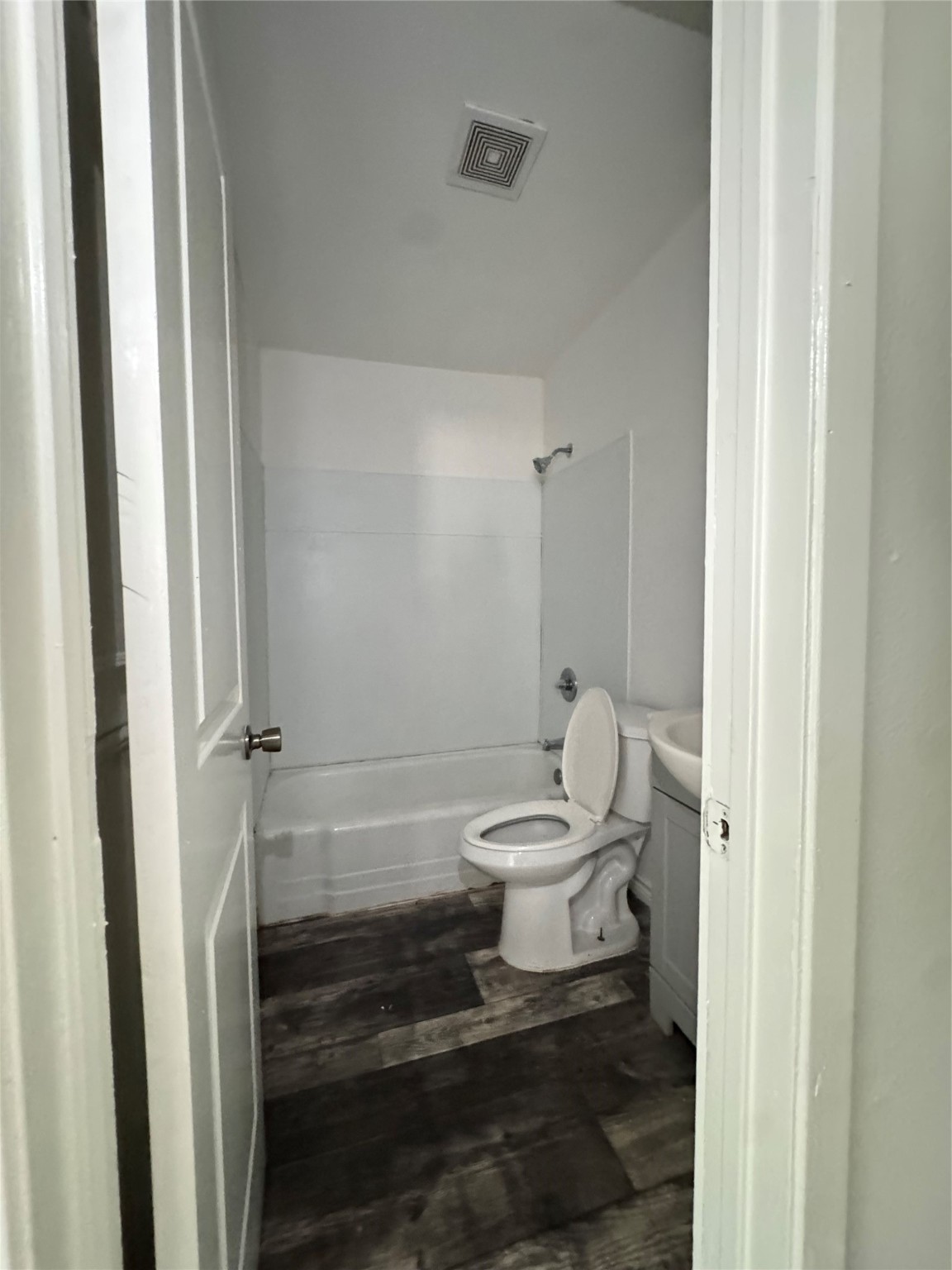 1824 Reese Street Liberty, TX 77575 - Photo 11 of 14 a white toilet sitting next to a bathroom sink