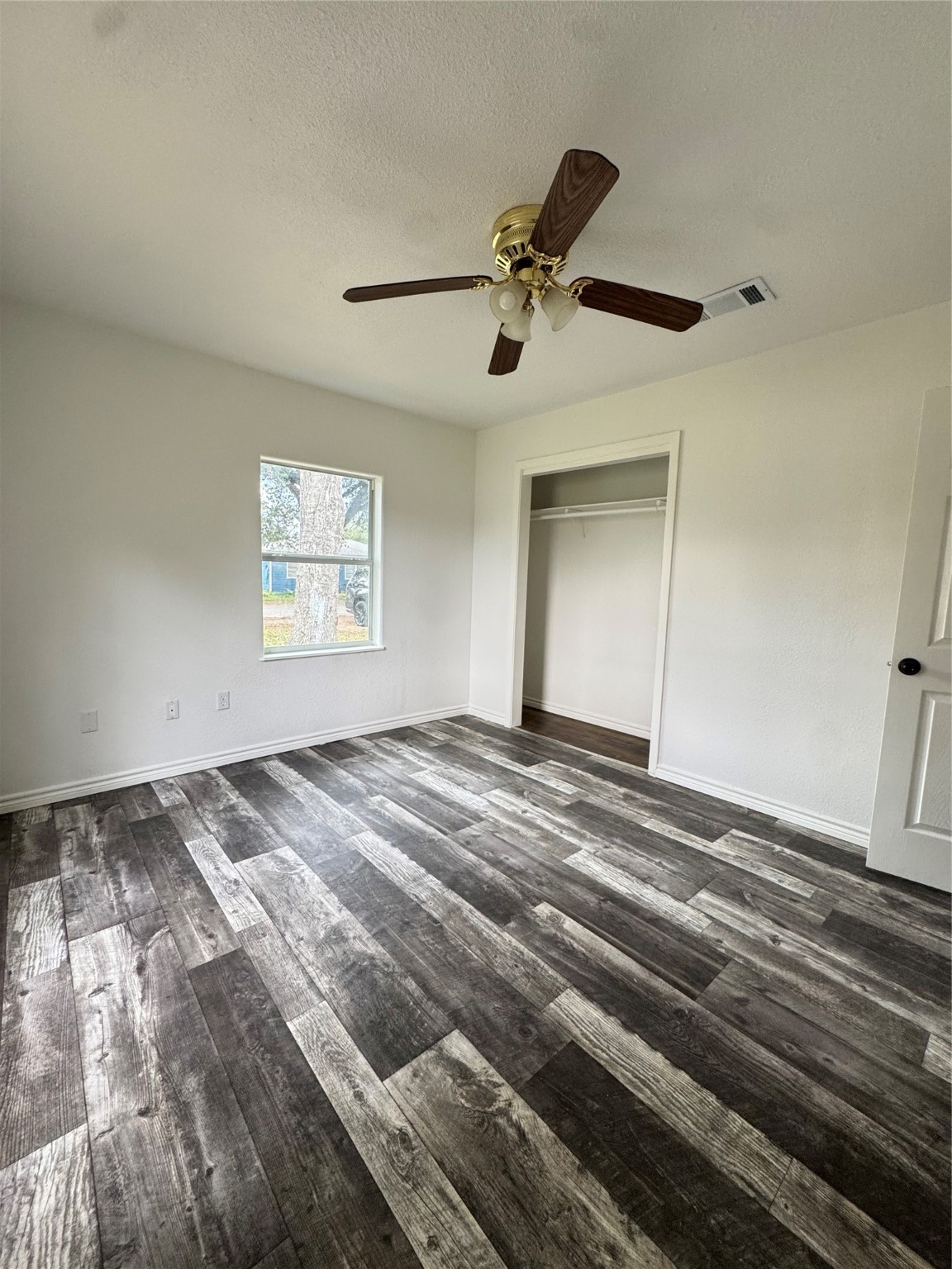 1824 Reese Street Liberty, TX 77575 - Photo 12 of 14 a view of a livingroom with a ceiling fan and window