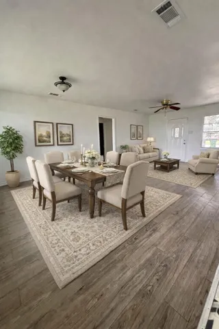 a living room with furniture and a rug