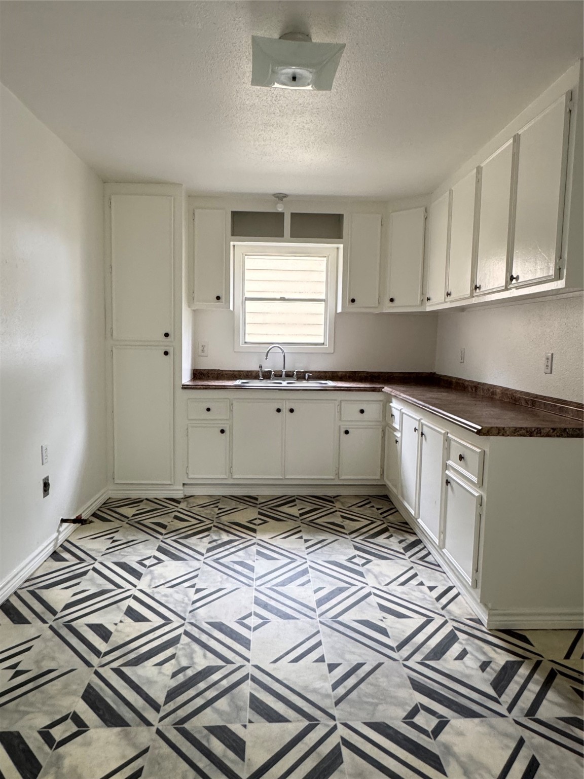 1824 Reese Street Liberty, TX 77575 - Photo 6 of 14 a kitchen with a stove top oven a sink and dishwasher