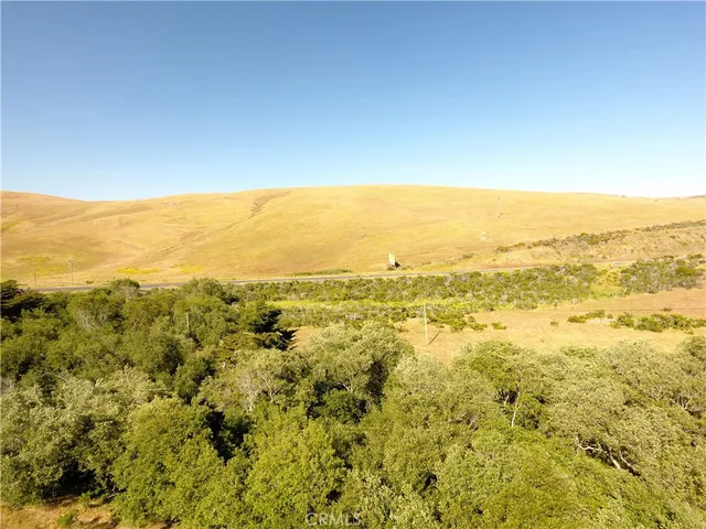 a view of an aerial view of mountain with an ocean