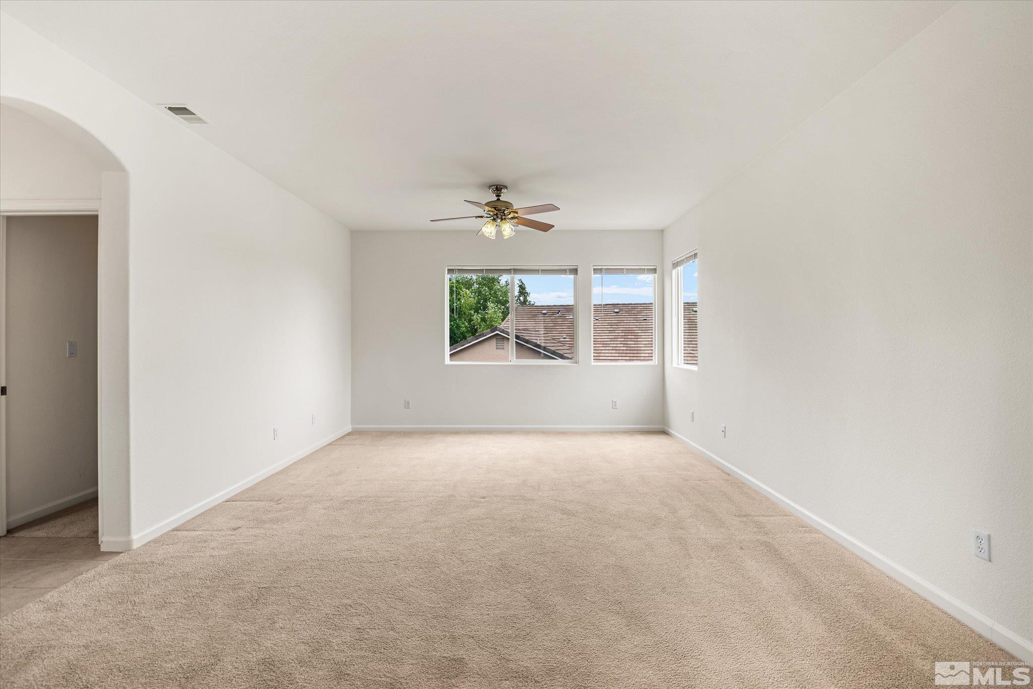 10555 Thistle Berry Court Reno, NV 89521 - Photo 16 of 35 an empty room with windows and closet