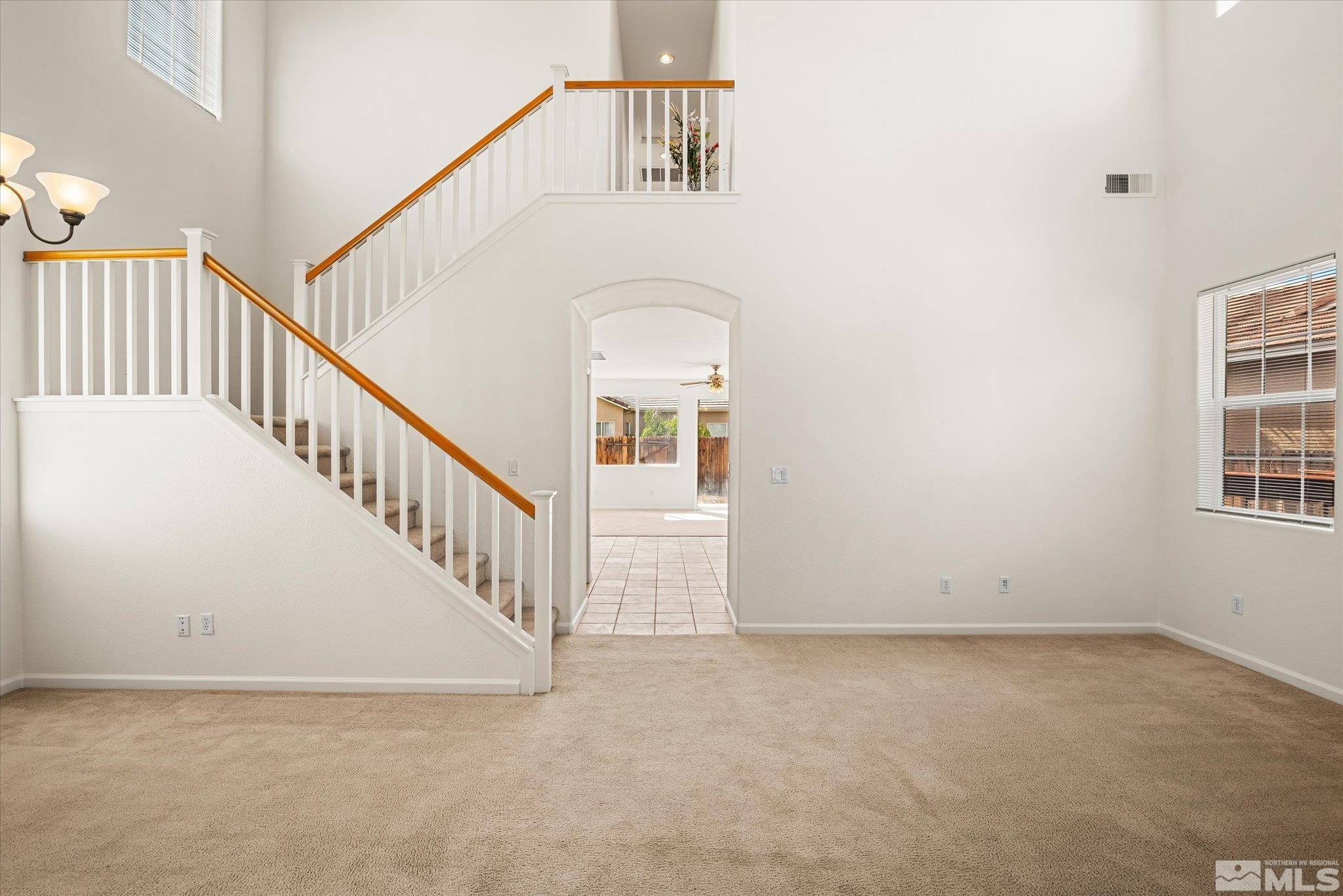 10555 Thistle Berry Court Reno, NV 89521 - Photo 3 of 35 a view of a hallway with staircase