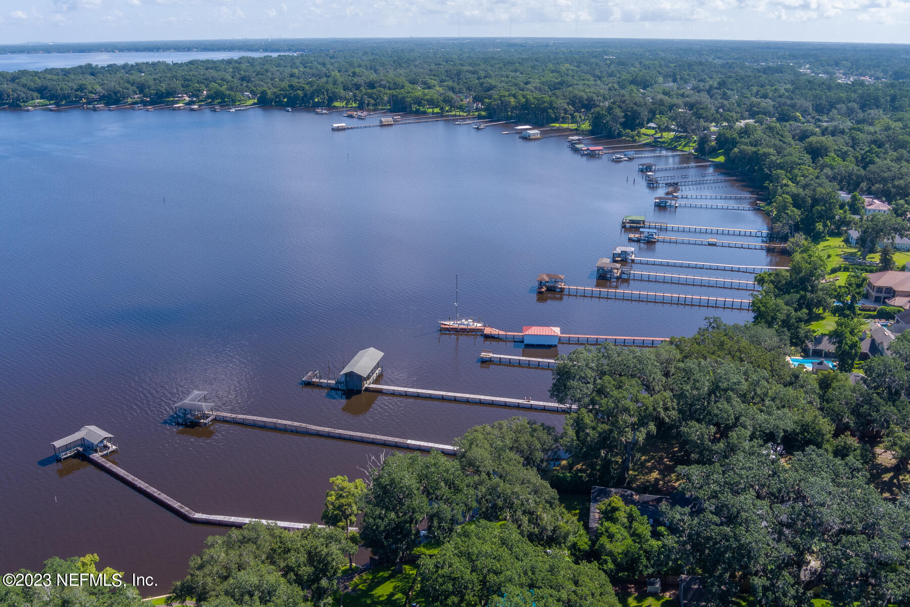 10566 Scott Mill Road Jacksonville, FL 32257 - Photo 10 of 12 an aerial view of a house with a yard and lake view