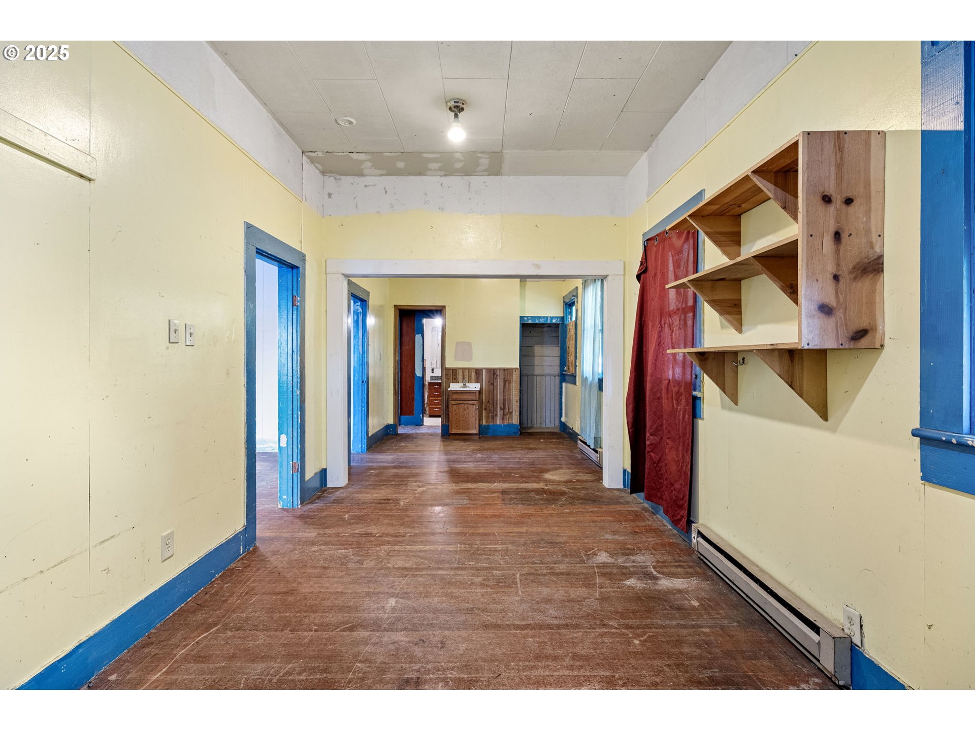 88144 4th Street Veneta, OR 97487 - Photo 8 of 21 a view of a hallway with wooden floor