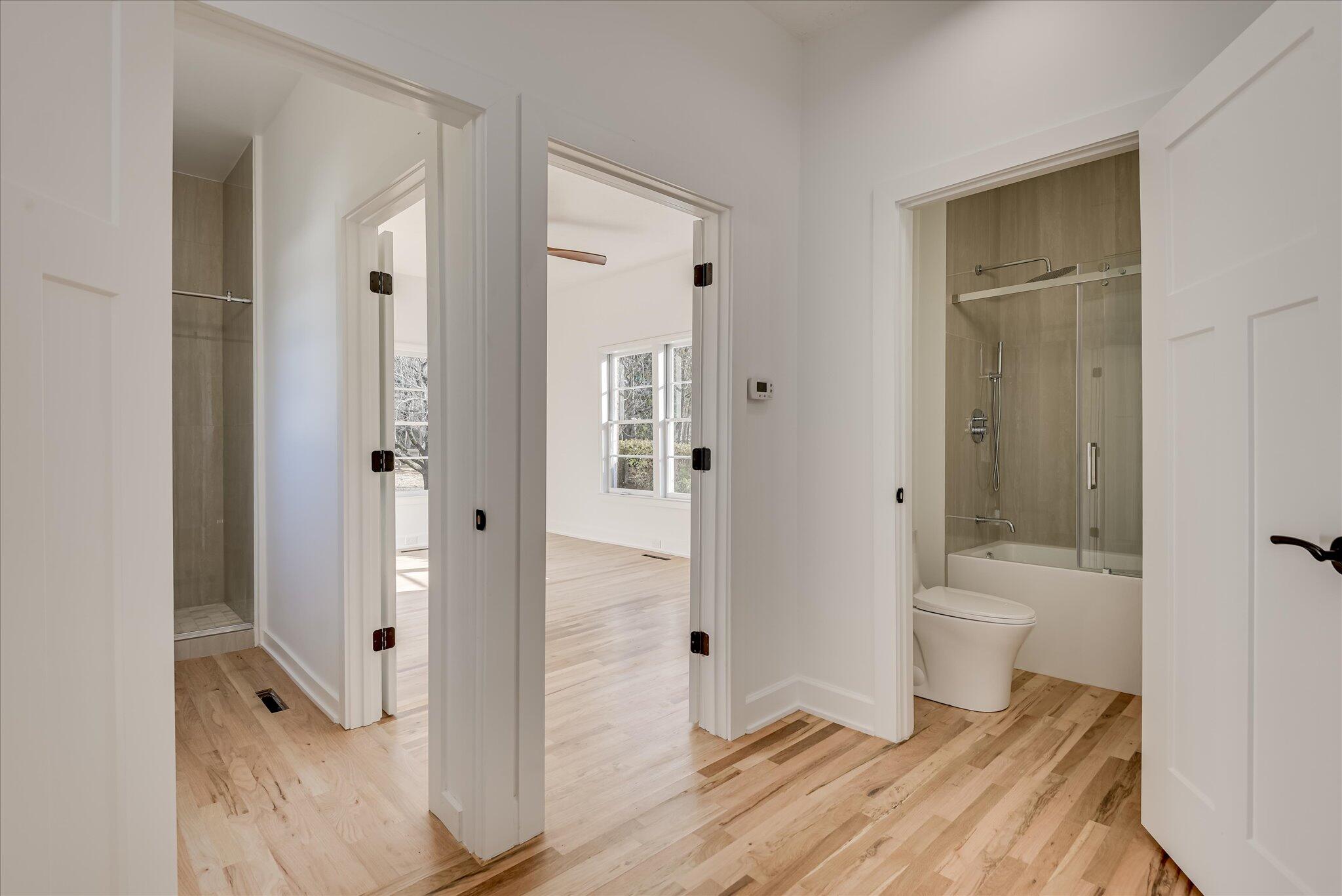 126 Mosley Road Aiken, SC 29801 - Photo 17 of 29 a bathroom with a glass door shower and a toilet