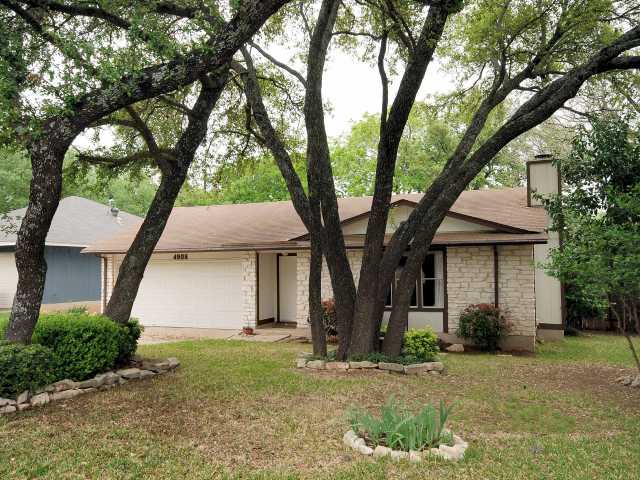 4908 Hawkhaven Lane Austin, TX 78727 - Photo 1 of 1 a tree in front of a white house