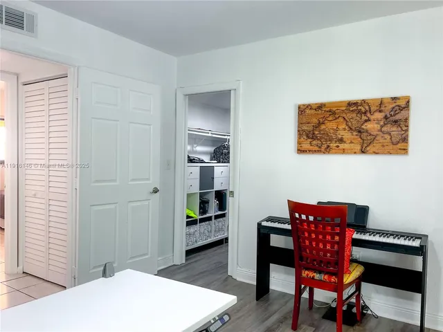 a view of a livingroom with furniture and a window
