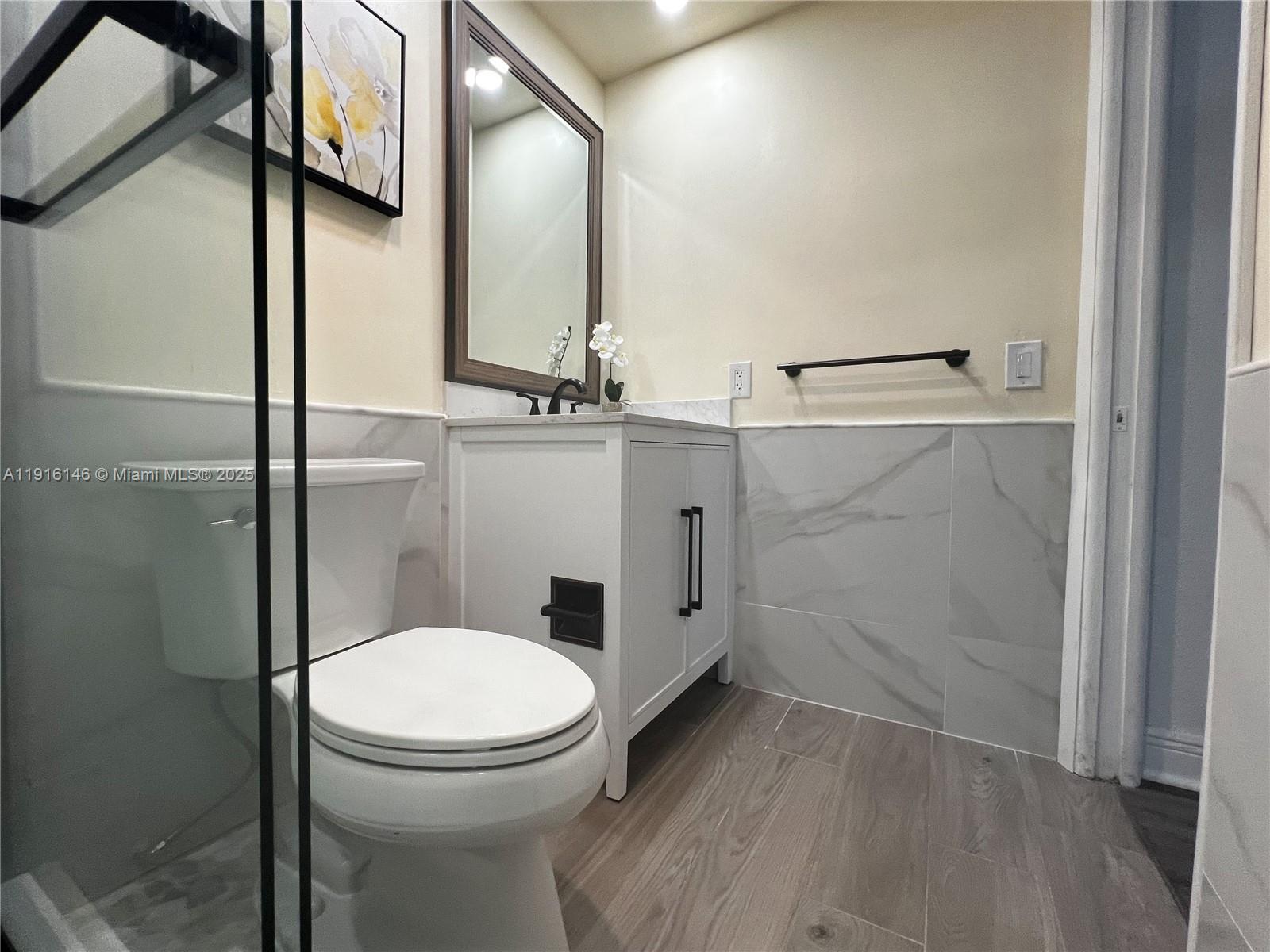 8600 Southwest 133rd Avenue Road, Unit 401 Miami, FL 33183 - Photo 16 of 31 a bathroom with a toilet and a shower