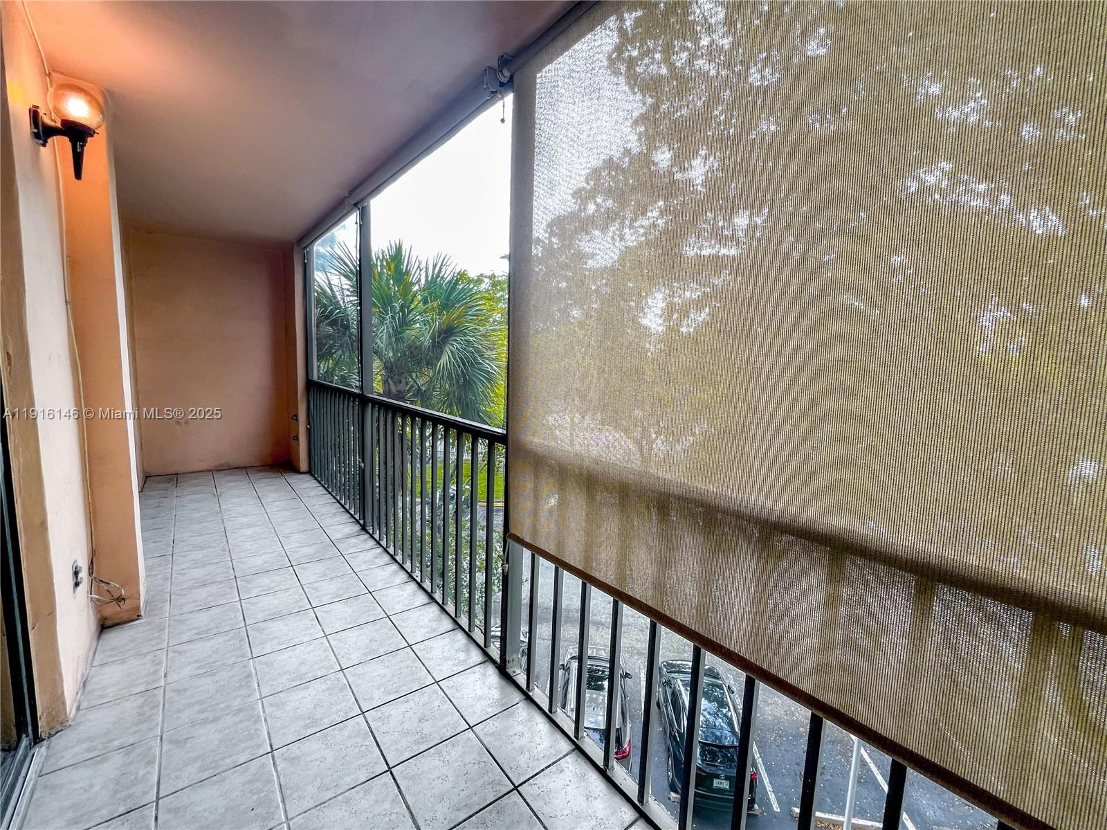 8600 Southwest 133rd Avenue Road, Unit 401 Miami, FL 33183 - Photo 18 of 31 a view of balcony with wooden floor