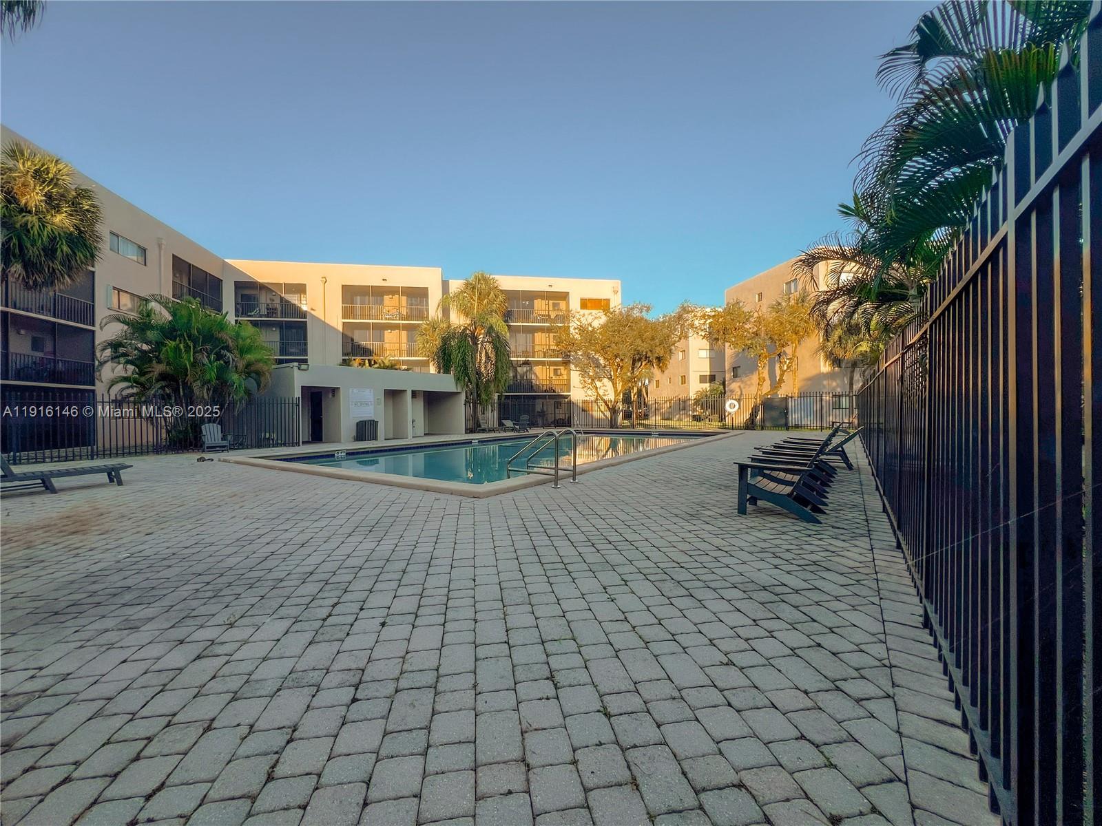 8600 Southwest 133rd Avenue Road, Unit 401 Miami, FL 33183 - Photo 20 of 31 a view of a terrace with sitting area