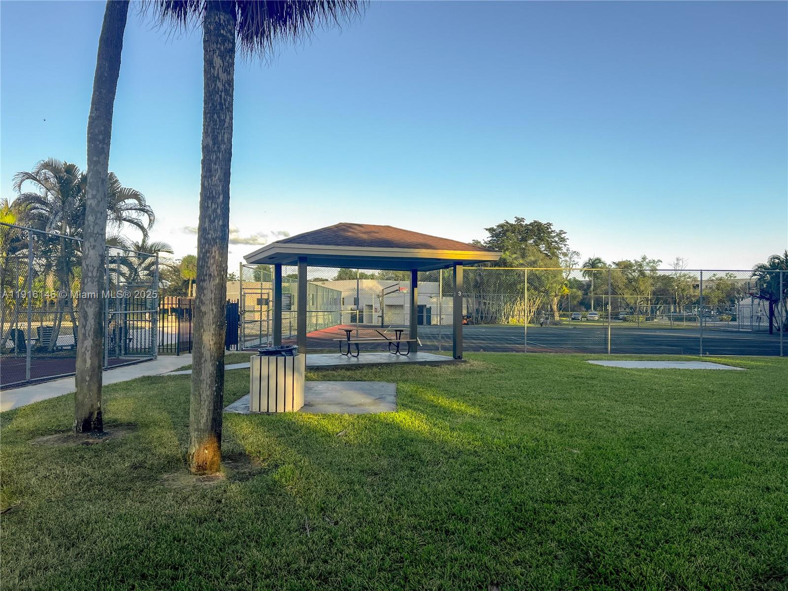 8600 Southwest 133rd Avenue Road, Unit 401 Miami, FL 33183 - Photo 27 of 31 a view of a house with a yard