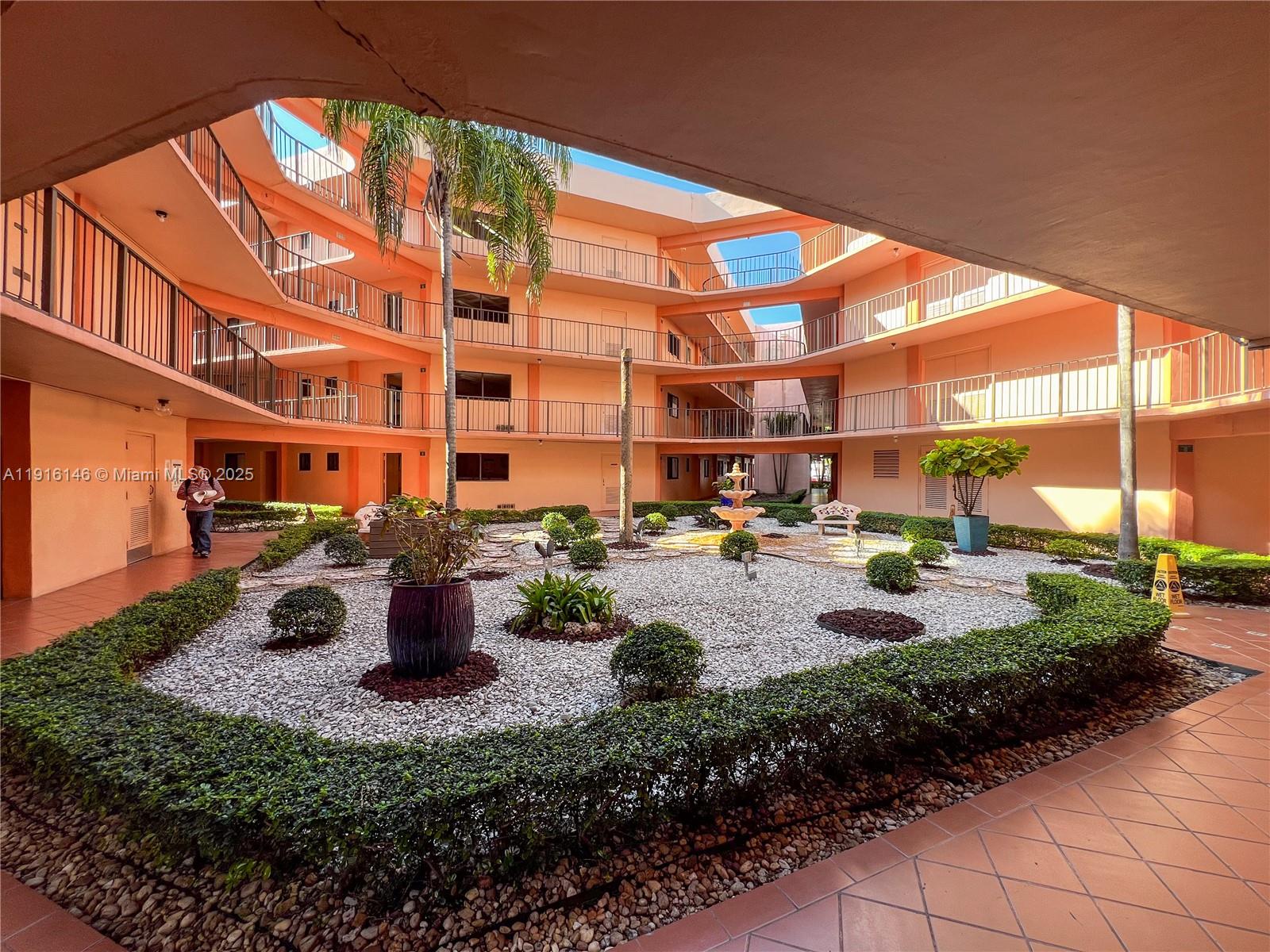8600 Southwest 133rd Avenue Road, Unit 401 Miami, FL 33183 - Photo 4 of 31 a view of swimming pool with outdoor seating and a garden