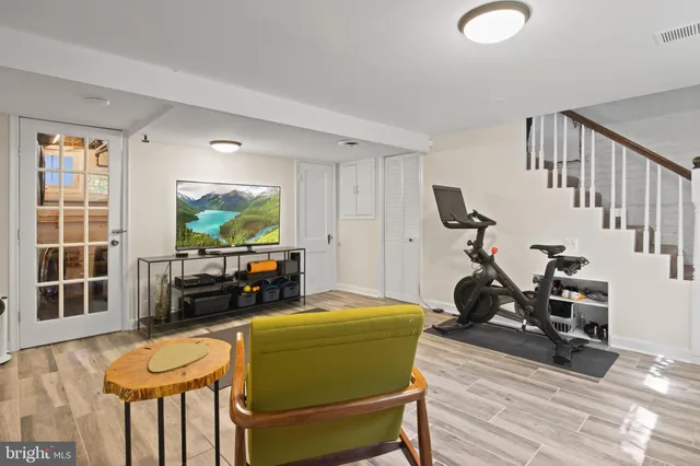 a bathroom with a sink a mirror and a shower