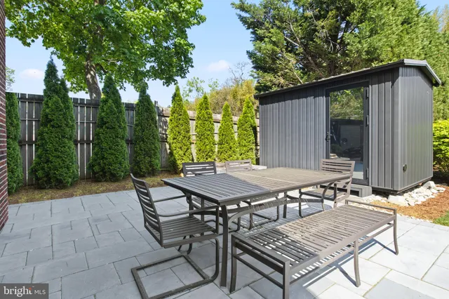a view of swimming pool with outdoor seating and plants