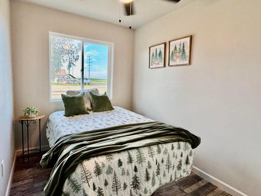 177 South Callison Road Tipton, CA 93272 - Photo 10 of 18 a bedroom with a bed and wooden floor