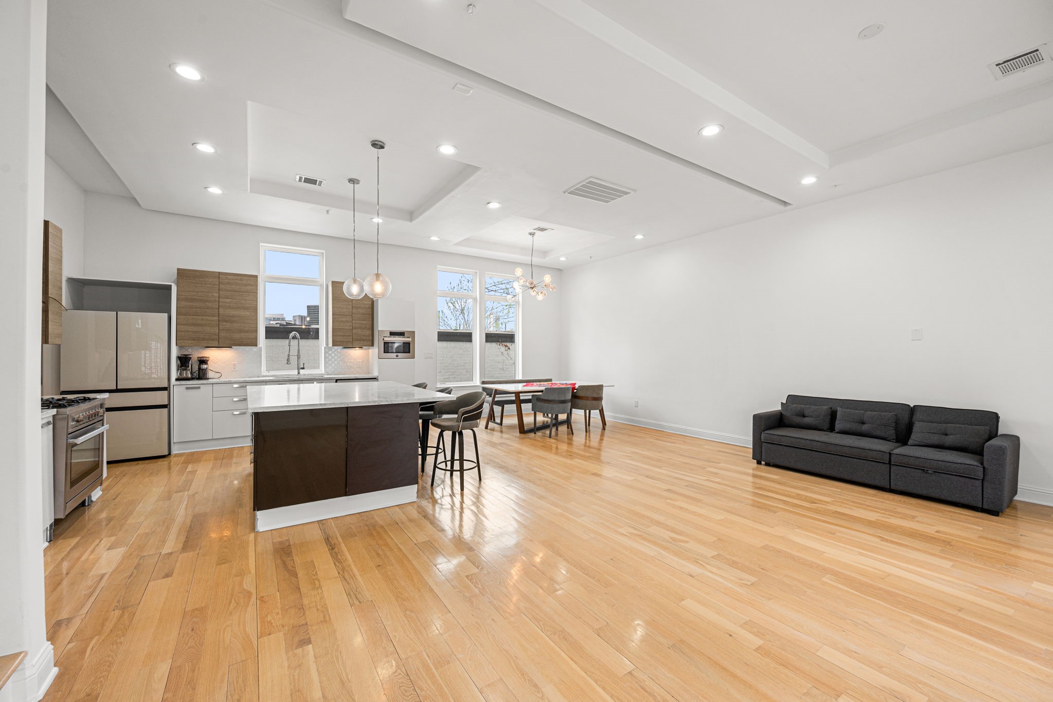 1842 Colquitt Street Houston, TX 77098 - Photo 11 of 42 a living room with stainless steel appliances furniture and a kitchen view