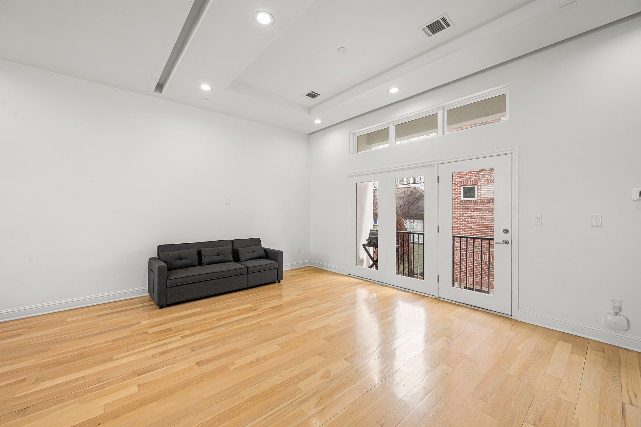 1842 Colquitt Street Houston, TX 77098 - Photo 12 of 42 a view of an empty room with wooden floor and a window