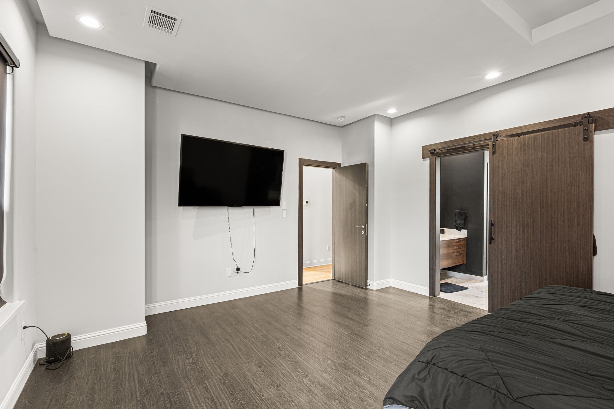 1842 Colquitt Street Houston, TX 77098 - Photo 20 of 42 a view of a livingroom with wooden floor and flat screen tv