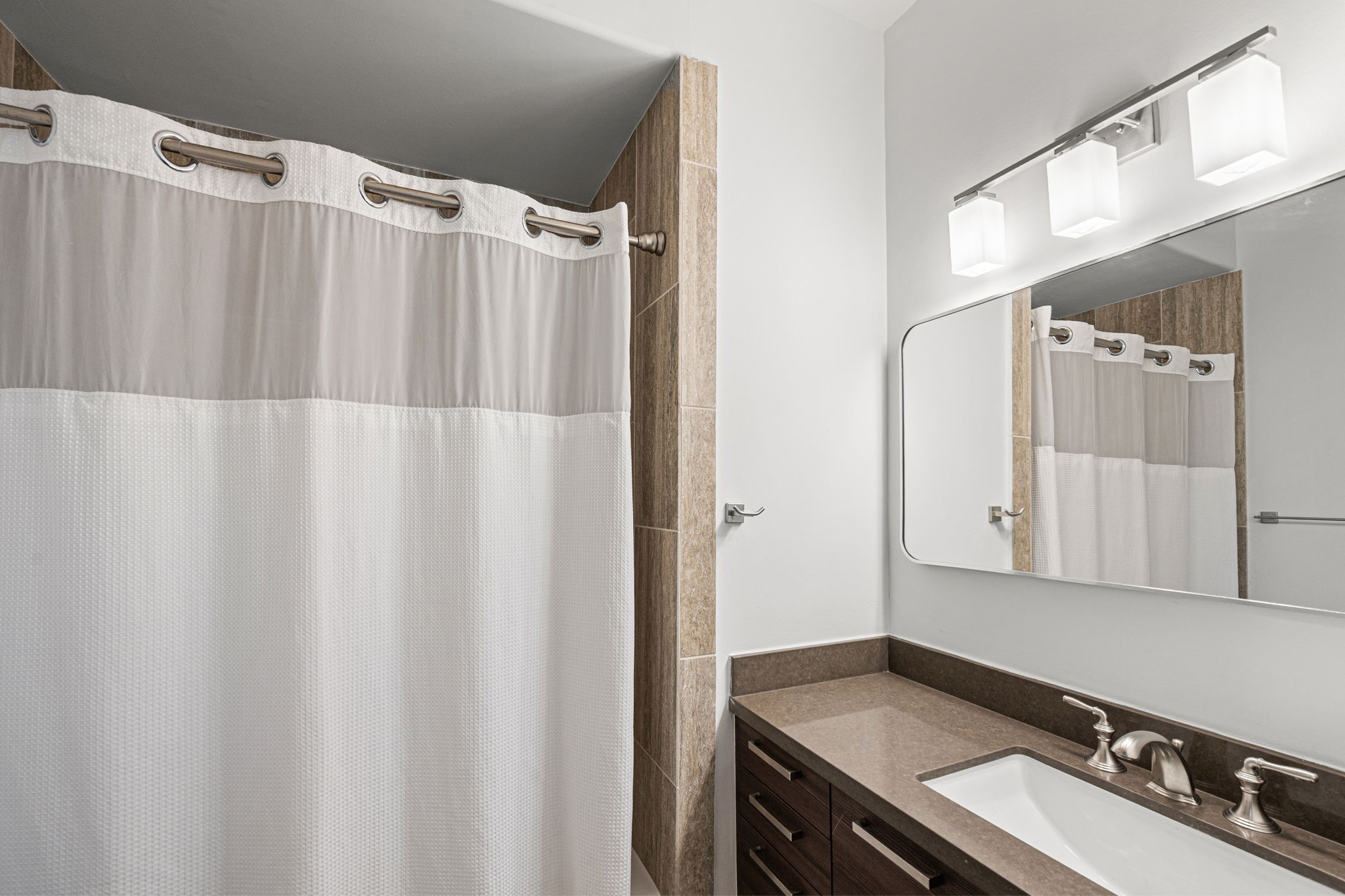 1842 Colquitt Street Houston, TX 77098 - Photo 26 of 42 a bathroom with a sink and a mirror