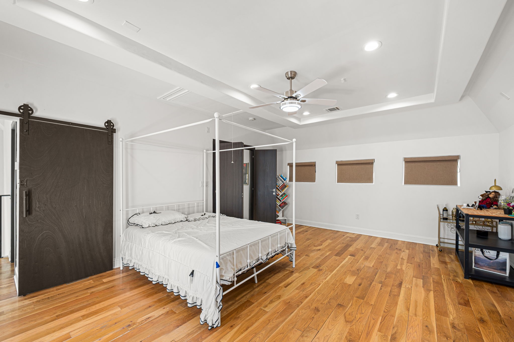1842 Colquitt Street Houston, TX 77098 - Photo 28 of 42 a spacious bedroom with a bed and a table