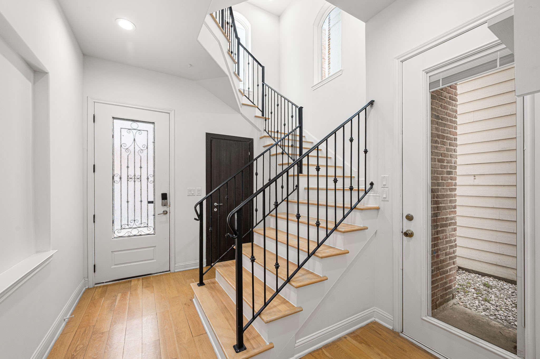 1842 Colquitt Street Houston, TX 77098 - Photo 6 of 42 a view of entryway with wooden floor and stairs