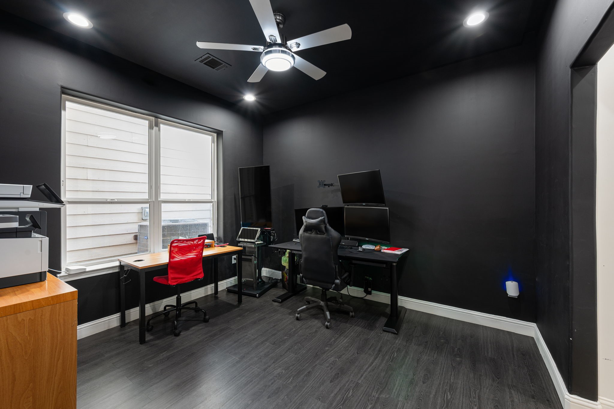 1842 Colquitt Street Houston, TX 77098 - Photo 7 of 42 a view of a workspace with furniture and a window