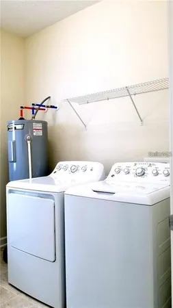 a utility room with dryer and washer