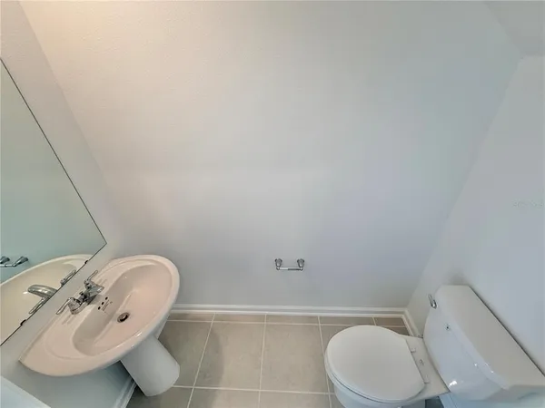 a view of an empty room and a window