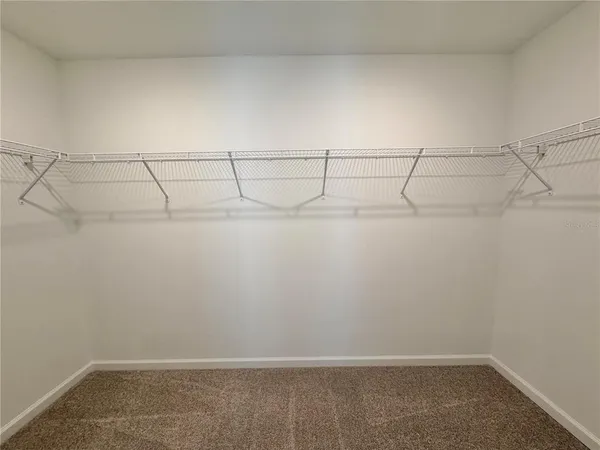 a view of a room with racks on the wall