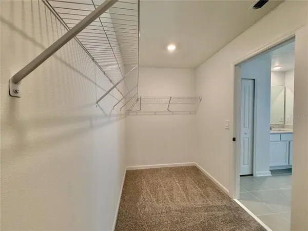 a view of a hallway with closet