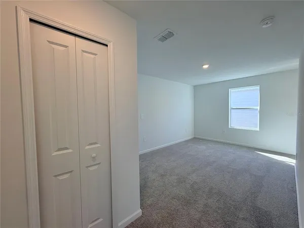 a view of a hallway with stairs