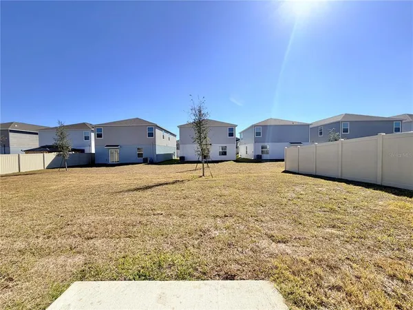 a view of garage and yard