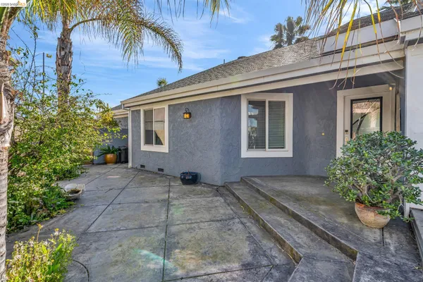 a kitchen with stainless steel appliances granite countertop a refrigerator stove top oven and sink