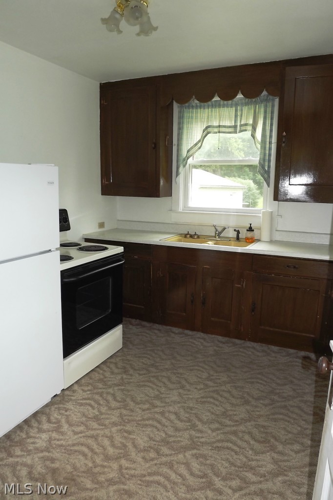 98 West Comet Road Clinton, OH 44216 - Photo 6 of 13 Cute as a button kitchen with refrigerator and stove