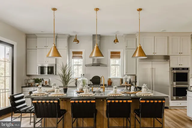 a dining table chairs and a wooden floor