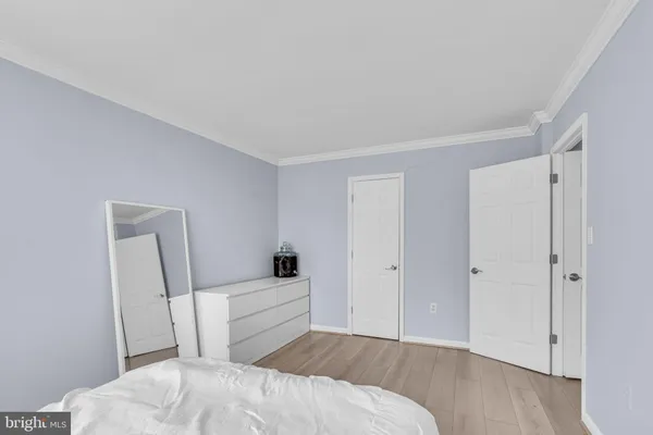 a bedroom with a bed and a chair