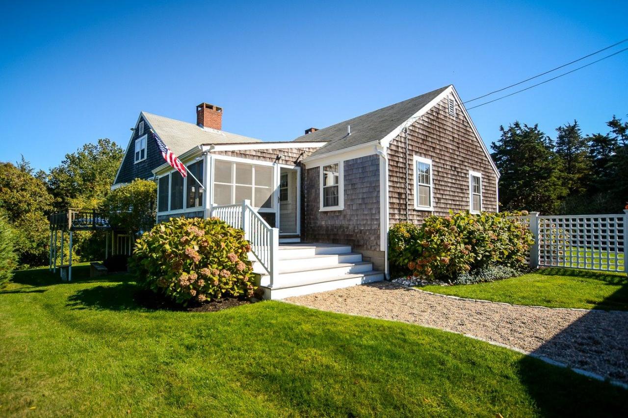 89 Briar Spring Road Orleans, MA 02653 - Photo 2 of 35 a front view of a house with garden