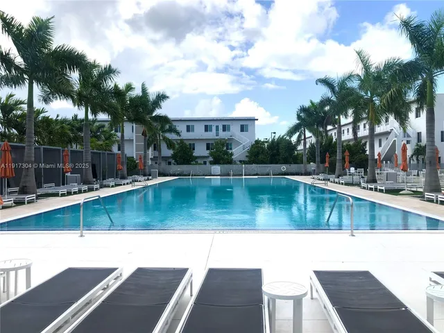 a view of swimming pool with a yard