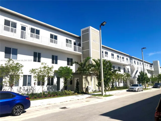 a front view of a building with street view