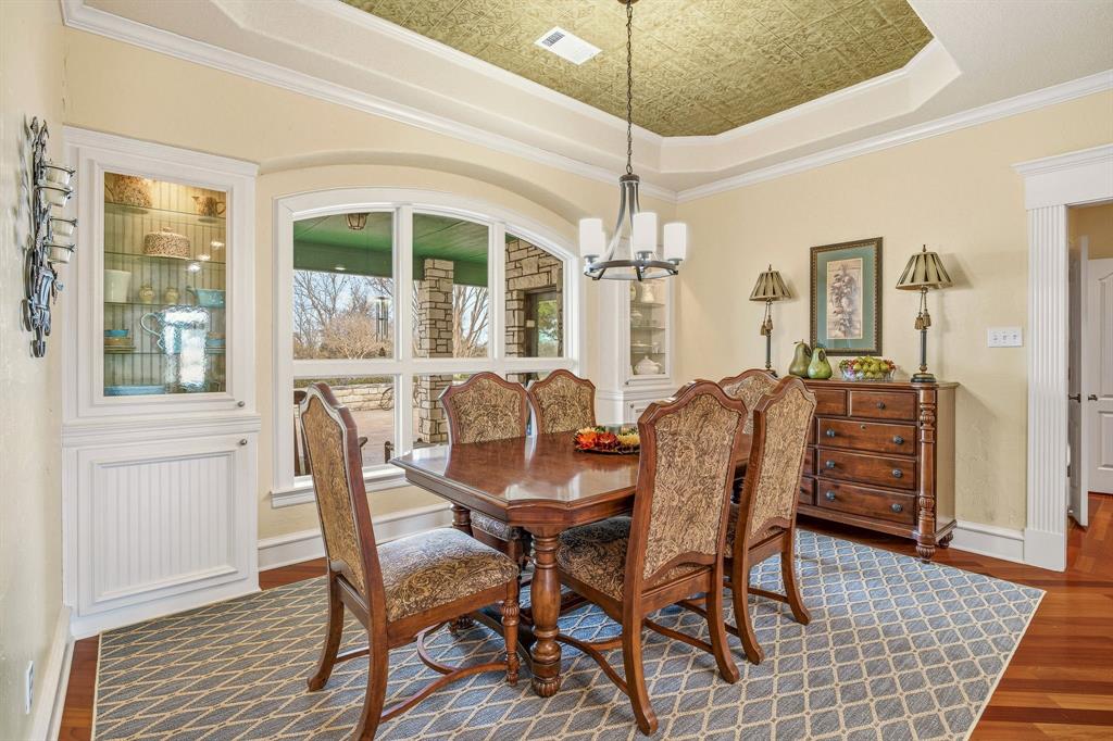 501 County Road 103 Comanche, TX 76442 - Photo 25 of 40 a view of a dining room with furniture window and wooden floor