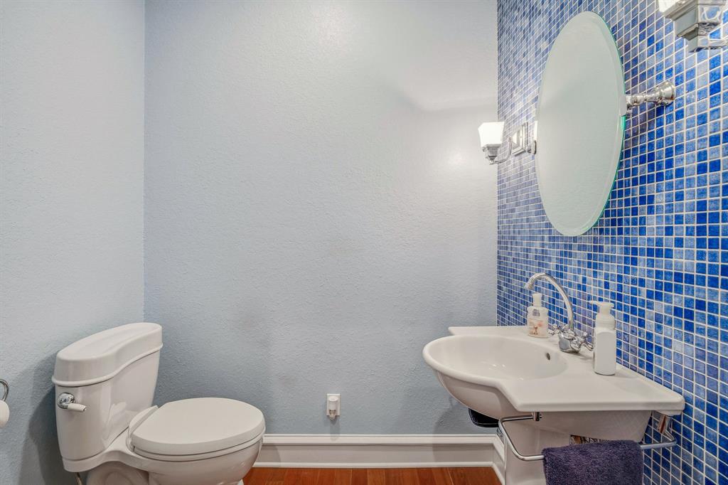 501 County Road 103 Comanche, TX 76442 - Photo 26 of 40 a bathroom with a sink a toilet and mirror