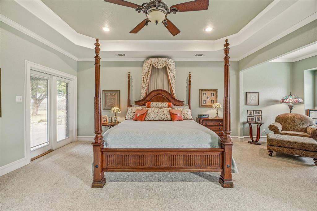 501 County Road 103 Comanche, TX 76442 - Photo 28 of 40 a bedroom with a bed window and couch