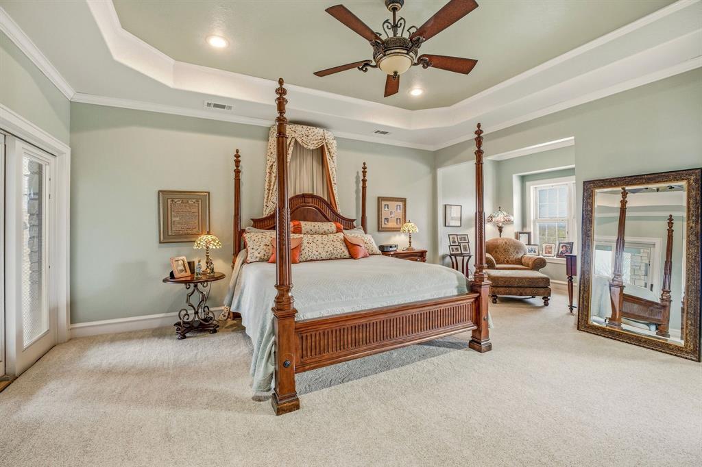 501 County Road 103 Comanche, TX 76442 - Photo 29 of 40 a bedroom with a bed gym equipment and a large window