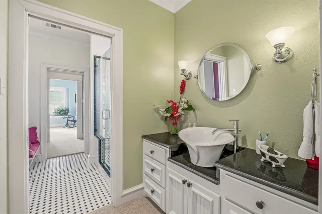 a bedroom with a bed and a dresser in it