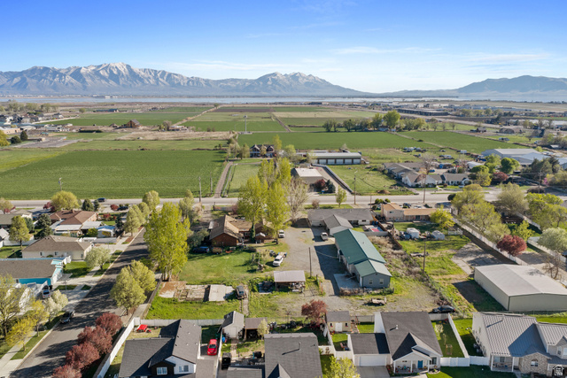 49 North 2830th West, Unit 3 Provo, UT 84601 - Photo 13 of 13 Aerial view of sparsely populated area featuring nearby suburban area and a mountain backdrop
