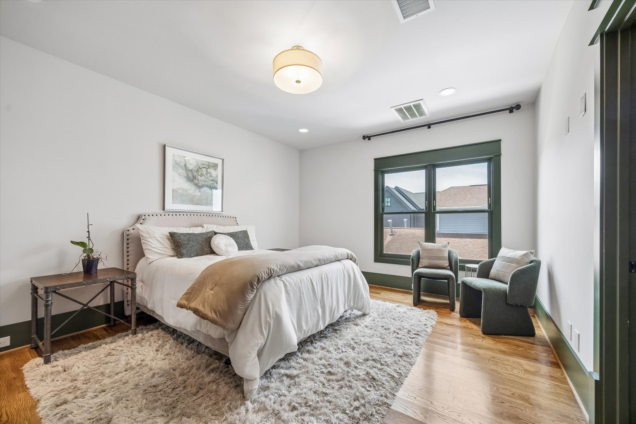 1101 Omar Street Houston, TX 77009 - Photo 30 of 46 TThe fourth bedroom functions beautifully as a secondary primary suite, offering exceptional privacy with an ensuite bath, oversized walk-in closet, and abundant storage throughout.