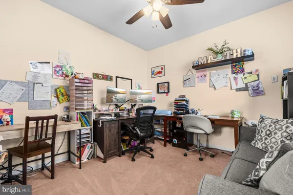 a view of a workspace with furniture