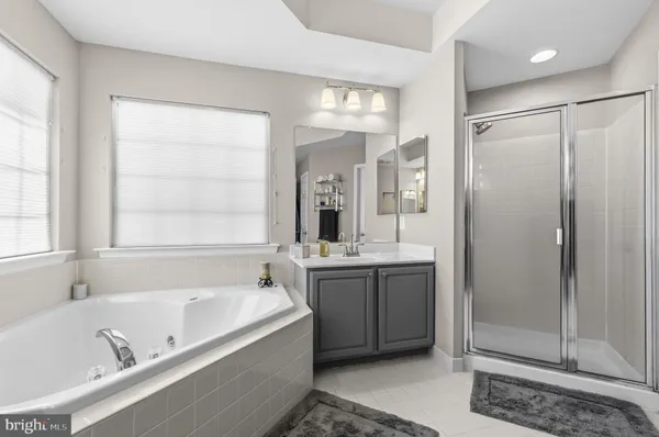 a bathroom with a bathtub and a sink